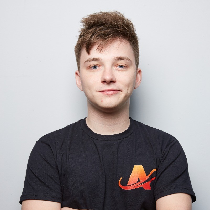 Young man wearing a black tshirt with an orange A